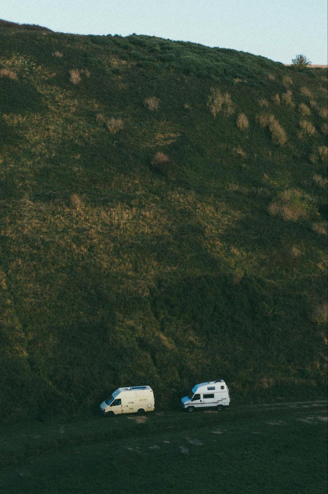 A car parked at a scenic camping site